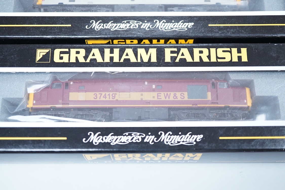 Three boxed Graham Farish N gauge railway Class 37/4 Co-Co diesel-electric locomotives; a Scottish EWS, Loch Awe (371151), a Regional Railways, Eisteddfod Genedlaethol 37429 (371154), and an EWS, 37419 (371153).